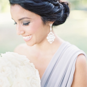 Bridesmaid in Lilac Gray with Statement Earrings and a White Rose Bouquet