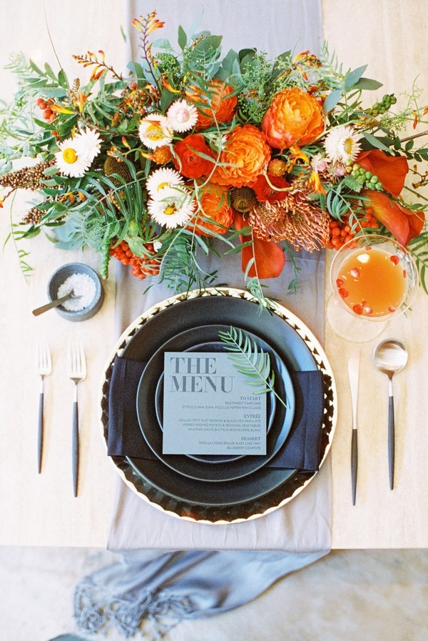 Modern Black and Orange Place Setting with a Specialty Cocktail