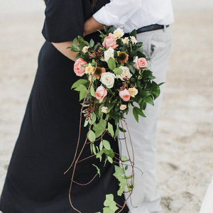 Surprise-Beach-Anniversary-Session-Bride-with-cascading-greenery-bouquet