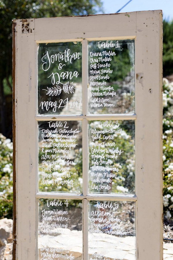 Tuscan-Inspired-Wedding-wooden-glass-door-seating-chart
