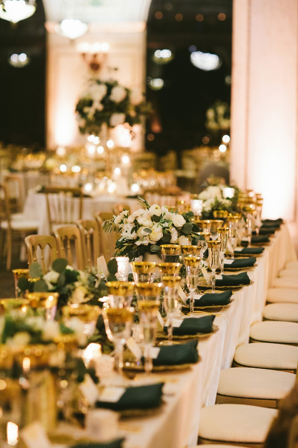 Elegant emerald green and gold wedding reception