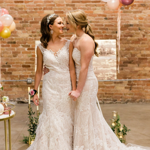 Same sex wedding with brides in lace dresses