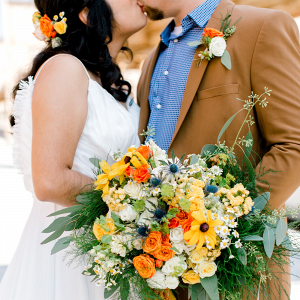 Vibrant yellow and orange bridal bouquet