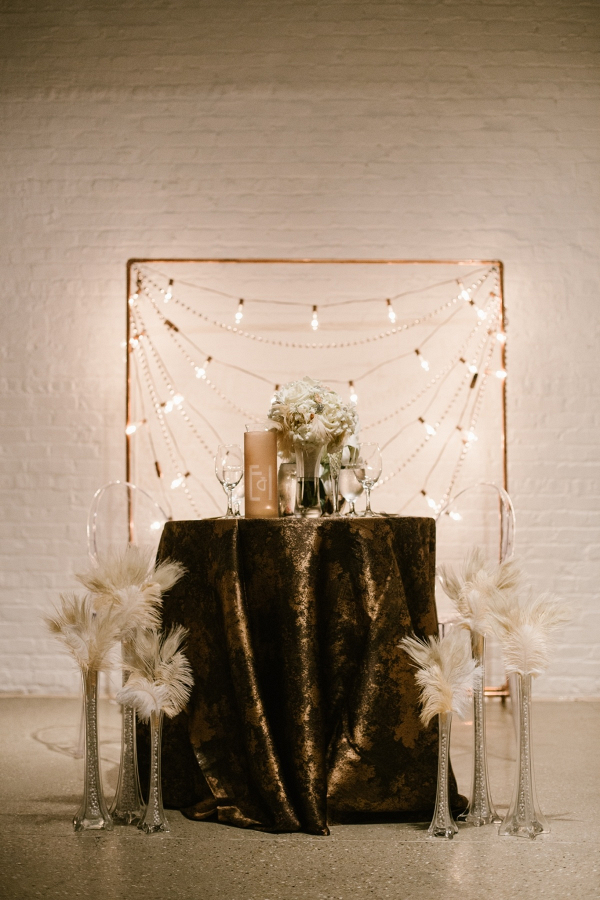 Art Deco vintage sweetheart table with feathers and beads