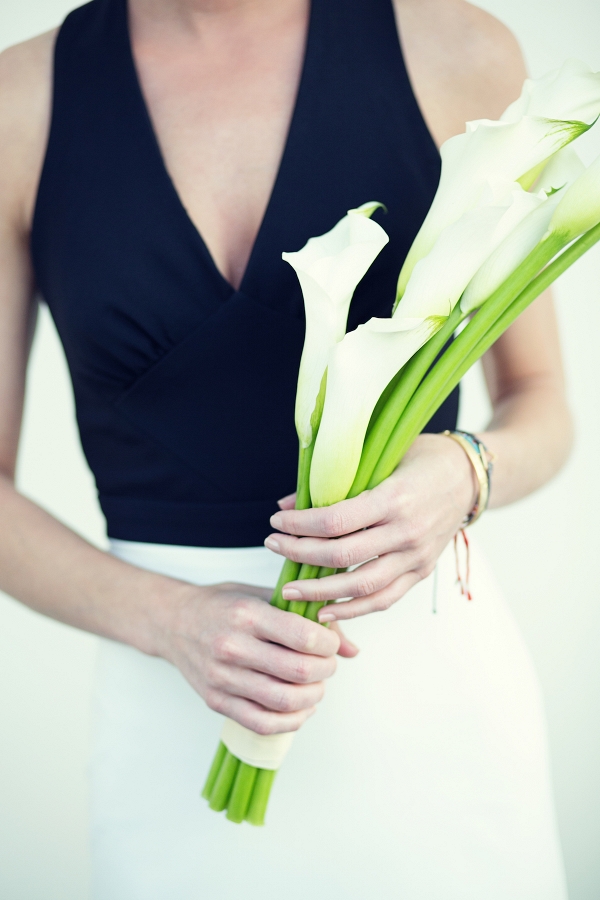 Black and white bridesmaid dress with calla lily bouquet