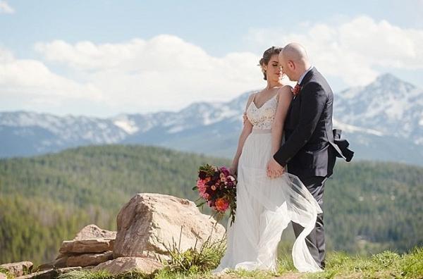 Bride and groom on mountainside