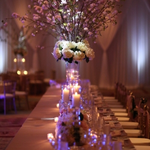 Blush Pink and White Floral Wedding Reception Centerpieces with Cherry Blossom Branches with Candlelight at Long Feasting Table | Sarasota Wedding Venue Ritz Carlton
