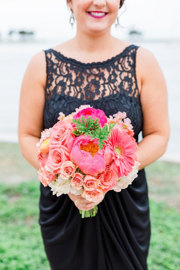 Bridesmaid in Navy Blue Bridesmaids Dress and Bright Coral and Pink Wedding Bouquet of Flowers