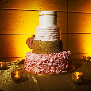 Four-Tiered White Gold and Blush Wedding Cake with Blush Pink Ruffled Detail and Unique Accents