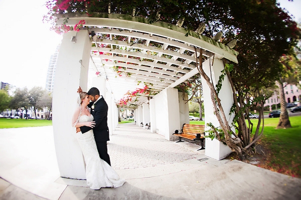 Wedding Portrait of Bride and Groom Under Lattice Portico with Ivy and Trellis in Downtown Florida Park
