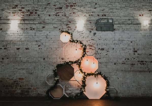 Wedding Reception Wall Decor with Wooden Geometric Shaped and Lights | Downtown Tampa Wedding Venue The Rialto
