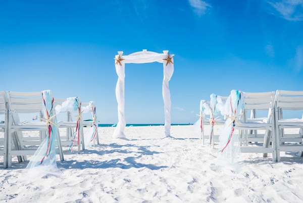 Florida Beach Wedding Ceremony Altar with White Draped Linen and Starfish 