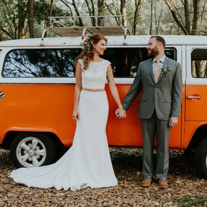 Couple in front of orange vintage van