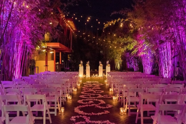 Outdoor, Nighttime St. Petersburg Wedding Ceremony Aisle with Pink Uplighting and Aisle of Flowers | St. Pete Wedding Venue NOVA 535