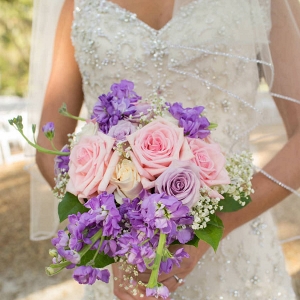 Bridal Wedding Portrait in Ivory, Beaded Lace Wedding Dress and Pink and Purple Bouquet of Flowers
