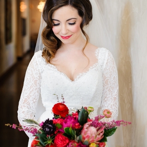 Bright Pink and Red Wedding Bouquet and Bride in Mikaella Bridal Lace Wedding Dress with Sleeves