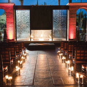 Candlelit Wedding Ceremony Aisle with Waterfall Background