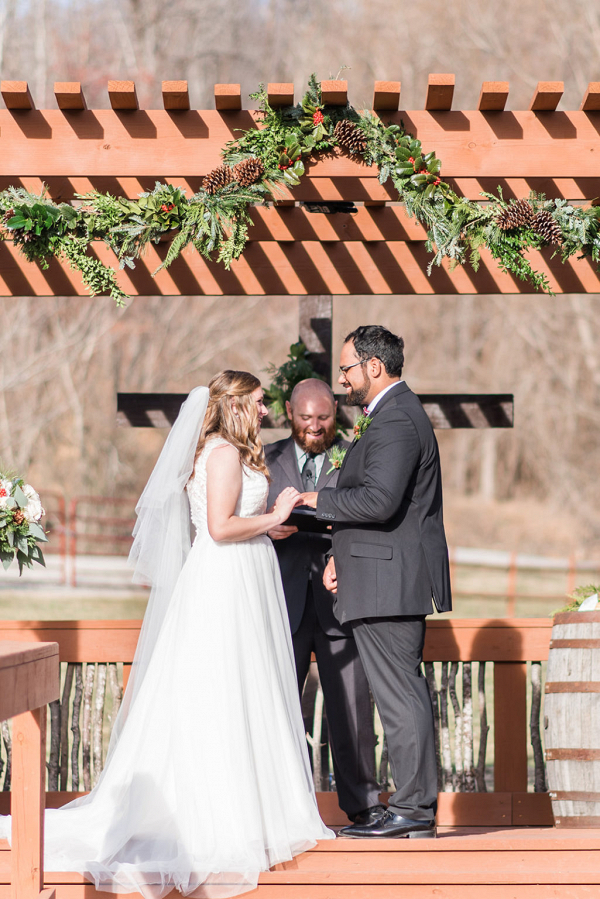 Evergreen and pinecone wedding ceremony