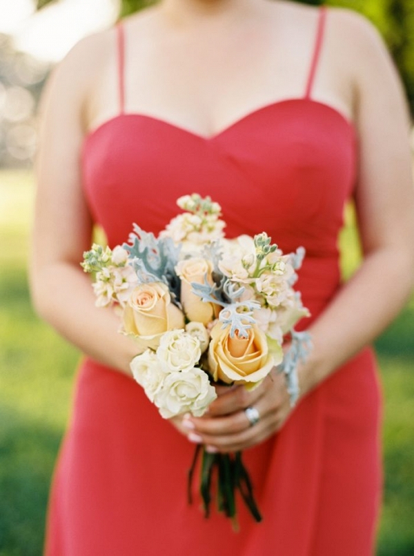 red bridesmaid dress with pink and peach bouquet