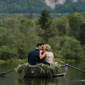Couple in rowboat on lake