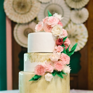 Gold painted wedding cake on Mountainside Bride