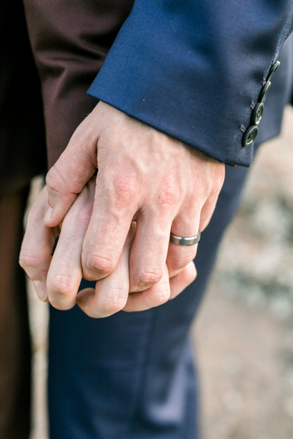 Hand in hand and a wedding band