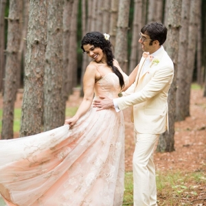 Woodland bride in a pink wedding gown with her groom