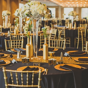 Black and gold ballroom reception