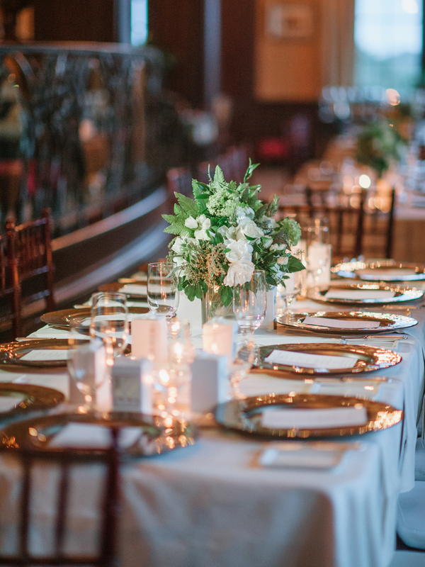 Elegant tablescape with rose gold chargers and chiavari chairs for an intimate reception