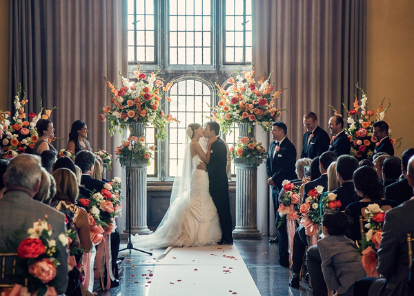 Elegant coral ballroom wedding ceremony at The Tudor Arms Hotel