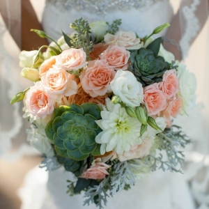 Romantic peach rose and succulent bridal bouquet