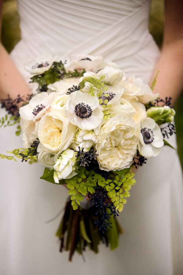 Cream and navy blue wedding bouquet with anemone and peonies
