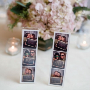 Photo booth photos as thank you notes for the wedding reception tables