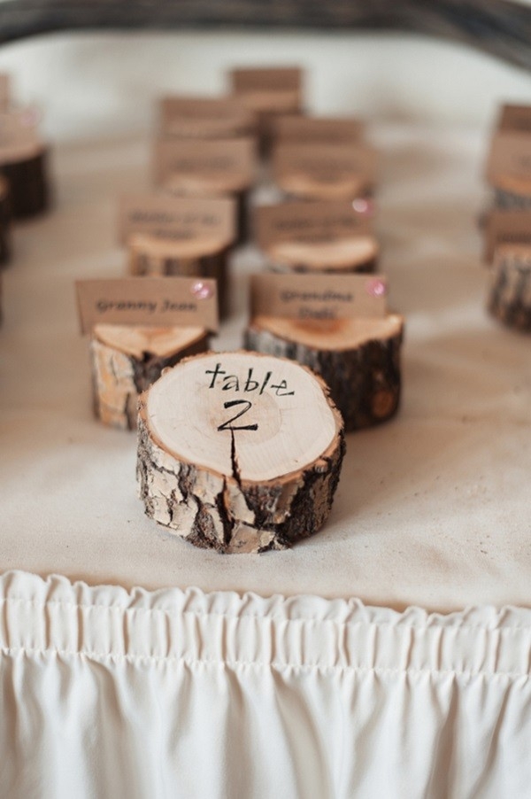 The cutest wood slices made into escort cards!