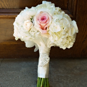 Pretty rose and hydrangea bouquet with ribbon and rhinestone brooch