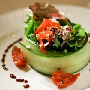 Elegant salad wrapped in a cucumber slice