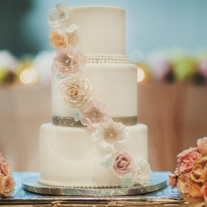 Fairy tale inspired wedding cake with sparkly bands and pastel sugar flowers