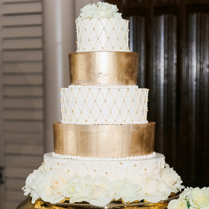 gold and white wedding cake