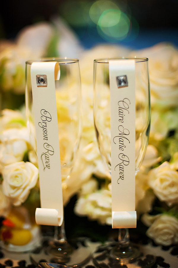 Chic champagne flutes with scroll style place cards