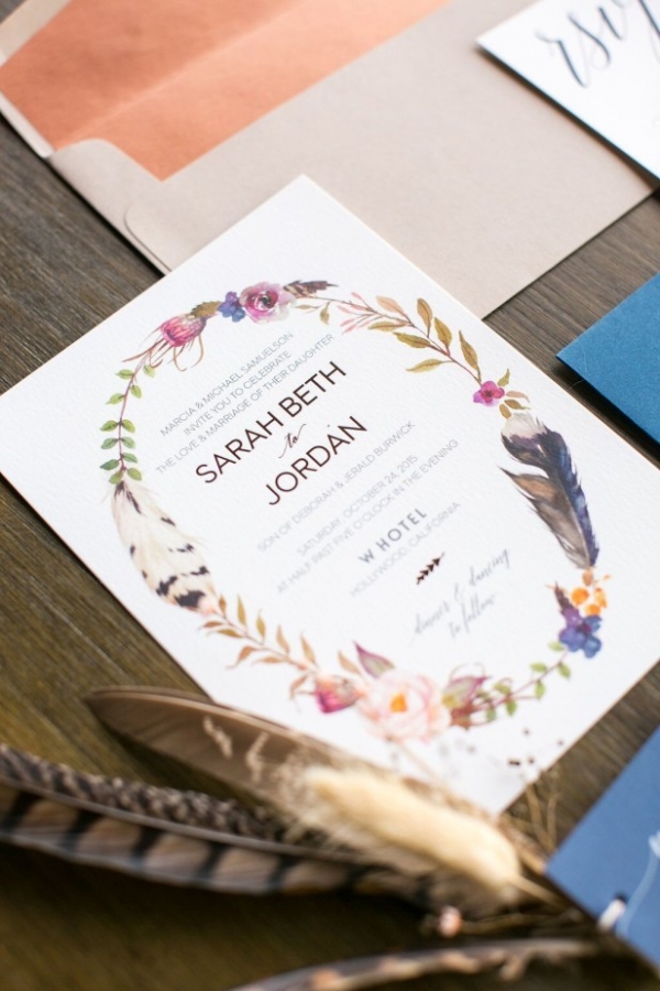 Bohemian wedding invitation with feather motif