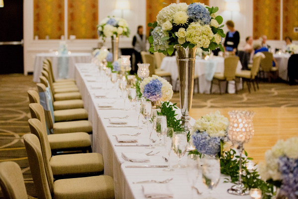 Classic wedding party table with hydrangea florals