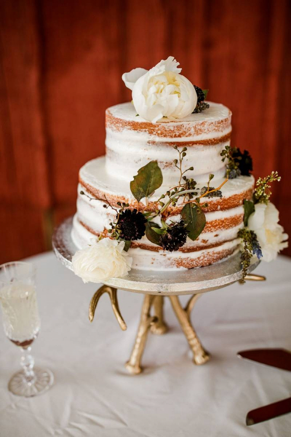 Classic semi naked wedding cake with fresh florals