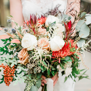 Wild peach and red bridal bouquet