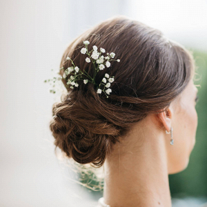 Bridal updo with baby's breath