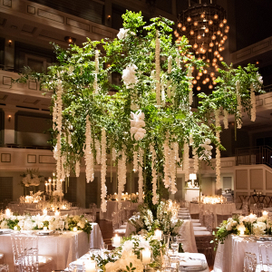 Luxe wedding reception with oversized draping floral centerpieces