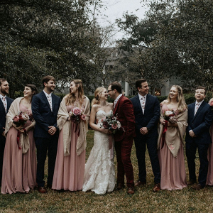 Winter wedding party with long gowns and shawls