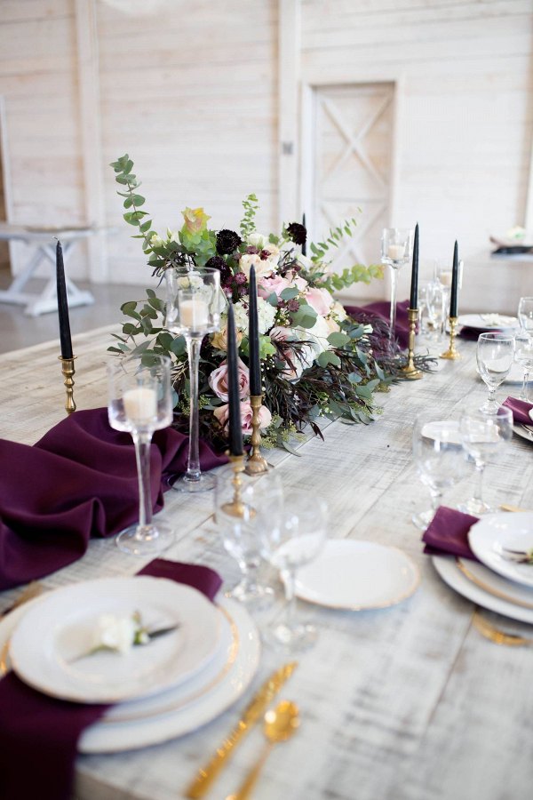 Winter tablescape with purple runner and taper candles