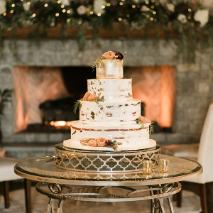Large semi-naked wedding cake with doughnut decoration