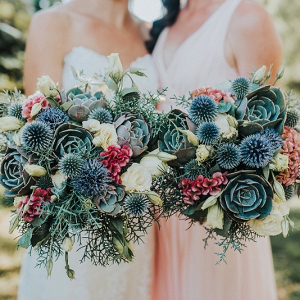 Bride and bridesmaid with rustic bouquets