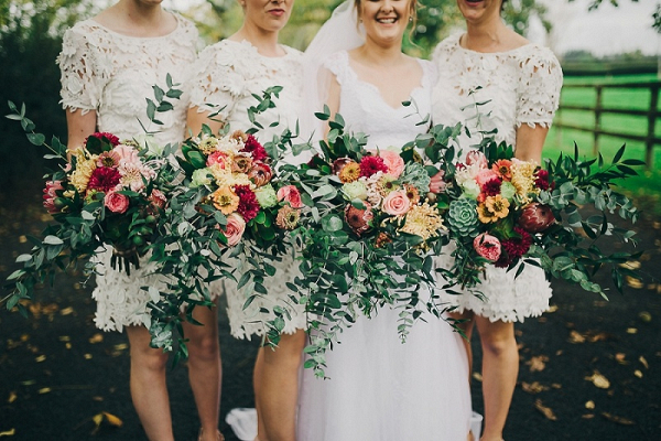 Bridesmaids in lace cut out dresses